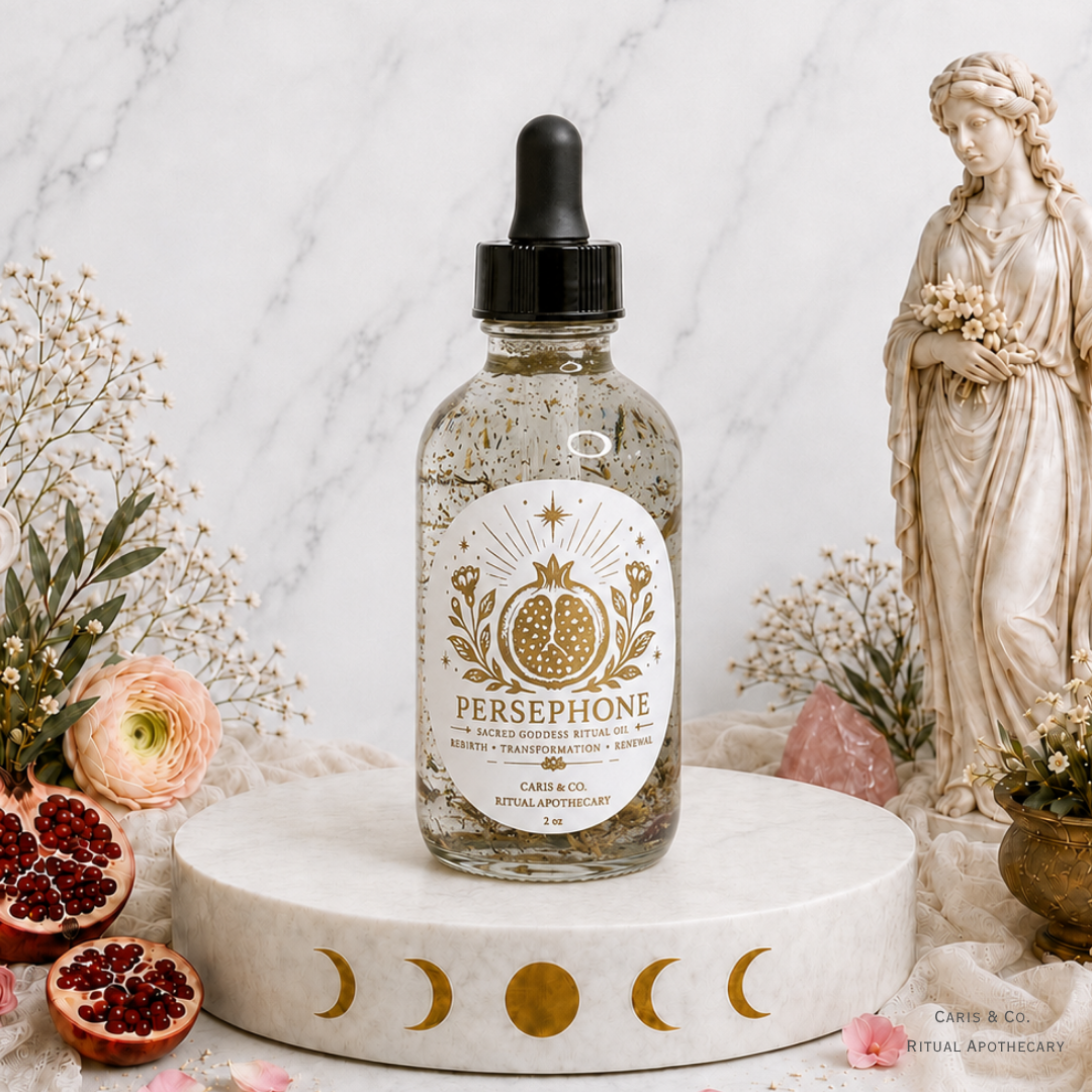 A glass dropper bottle of Persephone Ritual oil by  Caris & Co. Ritual Apothecary sits on a white marble pedestal decorated with gold moon phases.